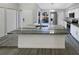 Modern kitchen with large island and granite countertops at 1505 Larkin Rd, Spring Hill, FL 34608