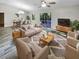 Bright and airy living room featuring a neutral color palette and ample natural light at 1505 Larkin Rd, Spring Hill, FL 34608