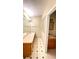 Bathroom with double vanity and hexagon tile floor at 2105 Vickery Ln, Dover, FL 33527