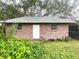 Brick building with a single door and two windows at 2105 Vickery Ln, Dover, FL 33527