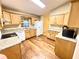 Kitchen with wood cabinets and laminate floors at 2105 Vickery Ln, Dover, FL 33527