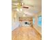 Living room with stone fireplace and hardwood floors at 2105 Vickery Ln, Dover, FL 33527