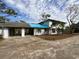 Home's exterior, showcasing carport and landscaping at 37921 Tiffany Rd, Dade City, FL 33525