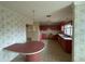 Pink kitchen with round table and built-in cabinets at 37921 Tiffany Rd, Dade City, FL 33525