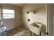 Laundry room with utility sink and overhead shelving at 37921 Tiffany Rd, Dade City, FL 33525