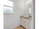 Clean bathroom with granite countertop and white cabinets at 4944 Alseir Rd, North Port, FL 34288