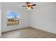Bedroom with large window and ceiling fan at 4944 Alseir Rd, North Port, FL 34288