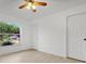 Bright bedroom with large window and ample closet space at 4944 Alseir Rd, North Port, FL 34288