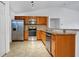 Modern kitchen with stainless steel appliances and granite countertops at 4944 Alseir Rd, North Port, FL 34288