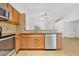 View of kitchen with wood cabinets and granite countertops at 4944 Alseir Rd, North Port, FL 34288