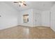 Bright living room with tile floors and a large window at 4944 Alseir Rd, North Port, FL 34288