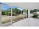 Enjoyable screened porch with tile flooring and backyard access at 4944 Alseir Rd, North Port, FL 34288