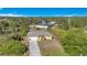 Aerial view of house, driveway, and surrounding area at 7864 Jayman Rd, North Port, FL 34291