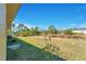 Side yard view, showing grassy area and some plants at 7864 Jayman Rd, North Port, FL 34291