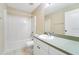 Bathroom with white vanity, tub, and toilet at 7864 Jayman Rd, North Port, FL 34291