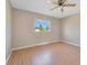 Bedroom with light walls and wood-look flooring at 7864 Jayman Rd, North Port, FL 34291