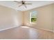 Bright bedroom with wood-look floors and a ceiling fan at 7864 Jayman Rd, North Port, FL 34291