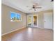 Large bedroom featuring sliding glass doors to lanai and ceiling fan at 7864 Jayman Rd, North Port, FL 34291
