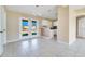 Dining room with tile floors, french doors, and kitchen access at 7864 Jayman Rd, North Port, FL 34291