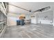 Attached garage with ample storage and ceiling fan at 7864 Jayman Rd, North Port, FL 34291