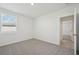 Well lit bedroom with gray carpet and window at 14109 Gunnison Cv, Parrish, FL 34219