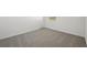 Empty bedroom with gray carpet and window at 14109 Gunnison Cv, Parrish, FL 34219