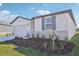 Newly built home with gray shutters, stone accents, and a two-car garage at 14109 Gunnison Cv, Parrish, FL 34219