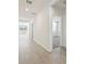 Bright hallway with tile flooring and access to other rooms at 14109 Gunnison Cv, Parrish, FL 34219