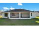 Home exterior showcasing a large screened porch at 14248 Salvatierra Ln, Port Charlotte, FL 33981