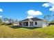 Home exterior with a large backyard at 14248 Salvatierra Ln, Port Charlotte, FL 33981