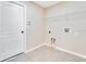 Bright laundry room with built-in shelving at 14248 Salvatierra Ln, Port Charlotte, FL 33981