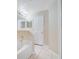 Bathroom with a bathtub and linen closet at 2315 Snowflake Ln, North Port, FL 34286