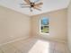 Bright bedroom with tile floors and a large window at 2315 Snowflake Ln, North Port, FL 34286