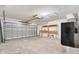 Garage with overhead door and storage shelves at 2315 Snowflake Ln, North Port, FL 34286