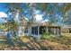 House exterior view, showcasing a large screened porch at 2315 Snowflake Ln, North Port, FL 34286