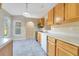 Kitchen with stainless steel appliances and wood cabinets at 2315 Snowflake Ln, North Port, FL 34286