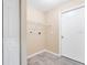 Laundry room with shelving and tile floor at 2315 Snowflake Ln, North Port, FL 34286