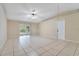 Living room with tile floors, vaulted ceiling, and access to a sunroom at 2315 Snowflake Ln, North Port, FL 34286