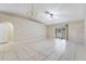 Living room with tile floors, vaulted ceiling, and access to a sunroom at 2315 Snowflake Ln, North Port, FL 34286