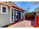 View of backyard deck and French doors leading inside at 7108 N 10Th St, Tampa, FL 33604