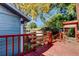 Backyard view with deck, shed, and lush landscaping at 7108 N 10Th St, Tampa, FL 33604