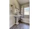 Full bathroom with a pedestal sink and shower/tub combo at 7108 N 10Th St, Tampa, FL 33604