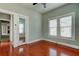 Bright bedroom with hardwood floors and ceiling fan at 7108 N 10Th St, Tampa, FL 33604