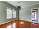 Dining room with hardwood floors and a stylish light fixture at 7108 N 10Th St, Tampa, FL 33604