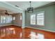 Light and airy dining room with hardwood floors and large windows at 7108 N 10Th St, Tampa, FL 33604