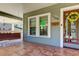 Front entrance with a decorative glass door and wreath at 7108 N 10Th St, Tampa, FL 33604