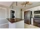 Kitchen boasts granite countertops and modern stainless steel appliances at 7108 N 10Th St, Tampa, FL 33604