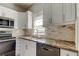 Modern kitchen with white cabinets, granite countertops and stainless steel appliances at 7108 N 10Th St, Tampa, FL 33604