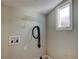 Small laundry room with shelving and hookups for washer and dryer at 7108 N 10Th St, Tampa, FL 33604