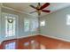 Bright living room featuring hardwood floors and windows at 7108 N 10Th St, Tampa, FL 33604